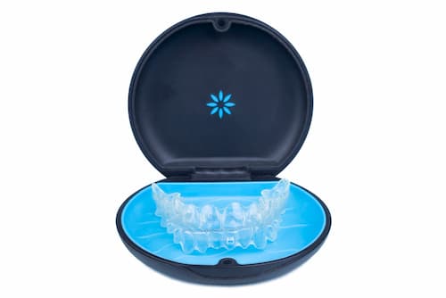 isolated-container-with-transparent-aligner-retainers-removable-braces-white-background (1)